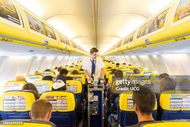 Trolley service on board a Ryanair flight, England, UK.