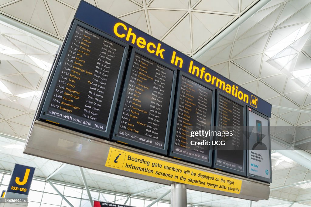 Check In Display Example Check-in information display board at Stansted Airport, England, UK ...