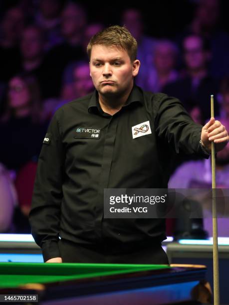 Michael White of Wales looks on in the qualifying match against Mark J. Williams of Wales on day one of 2023 Betvictor Welsh Open at Venue Cymru on...