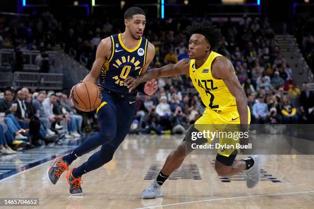 Tyrese Haliburton of the Indiana Pacers dribbles the ball while being guarded by Collin Sexton of the Utah Jazz in the second quarter at Gainbridge...