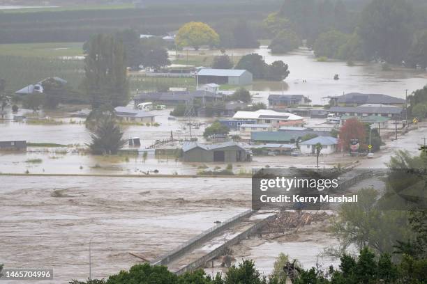 The Waiohiki bridge on the Tutaekuri River is washed away and houses flooded on February 14, 2023 in Napier, New Zealand. New Zealand has declared a...