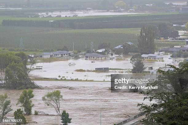 Houses are flooded in Waiohiki on February 14, 2023 in Napier, New Zealand. New Zealand has declared a national state of emergency with flooding and...