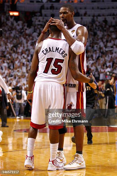 Mario Chalmers and Chris Bosh of the Miami Heat celebrate after they won 104-98 against the Oklahoma City Thunder in Game Four of the 2012 NBA Finals...
