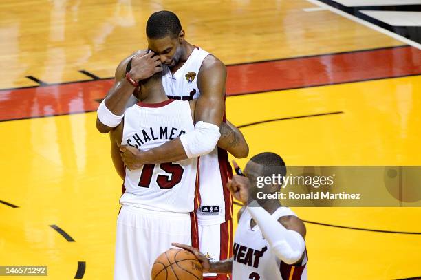 Mario Chalmers, Chris Bosh and Dwyane Wade of the Miami Heat celebrate after they won 104-98 against the Oklahoma City Thunder in Game Four of the...