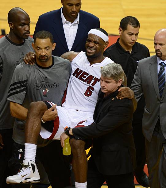 Injured LeBron James of the Miami Heat is carried off court during Game Four of the NBA Finals against the Oklahoma City Thunder on June 19, 2012 at...