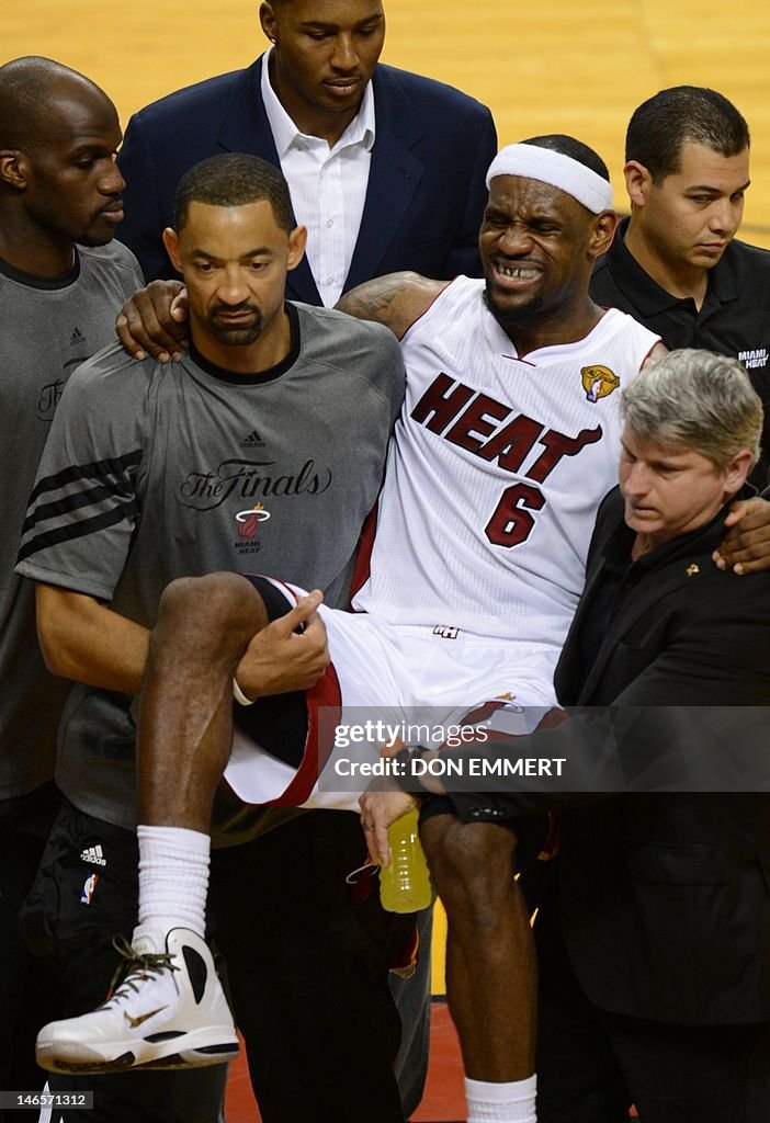 Injured LeBron James of the Miami Heat i