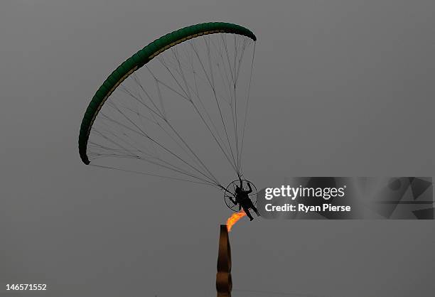 Competitor flies past The Games Cauldron during the Powered Paragliding Open Individual Combined Final on Day 4 of the 3rd Asian Beach Games Haiyang...