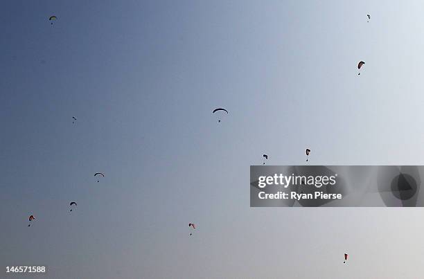 Competitors warm up during the Powered Paragliding Open Individual Combined Final on Day 4 of the 3rd Asian Beach Games Haiyang 2012 on June 20, 2012...