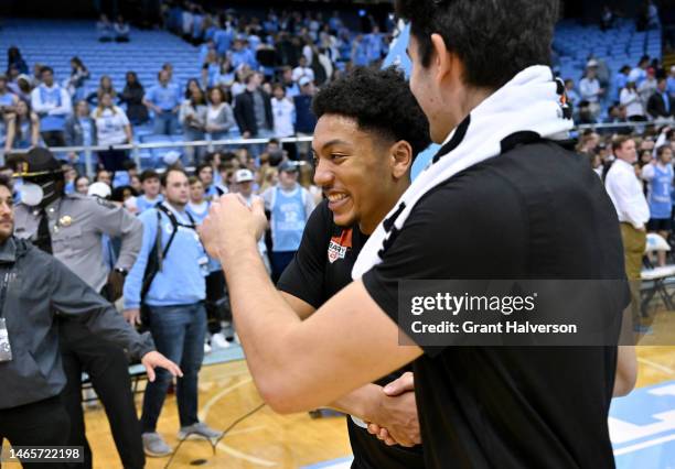 Nijel Pack of the Miami Hurricanes celebrates with a teammate as they leave the floor after a win over the North Carolina Tar Heels at the Dean E....