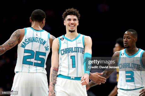 LaMelo Ball of the Charlotte Hornets smiles as he walks back to the bench during the third period of a basketball game against the Atlanta Hawks at...