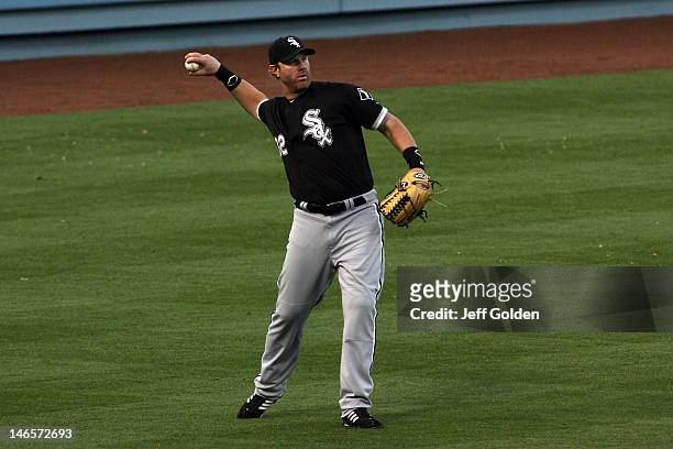 Adam Dunn of the Chicago White Sox throws the ball to the infield after catching a fly ball against the Los Angeles Dodgers for the second out in the...