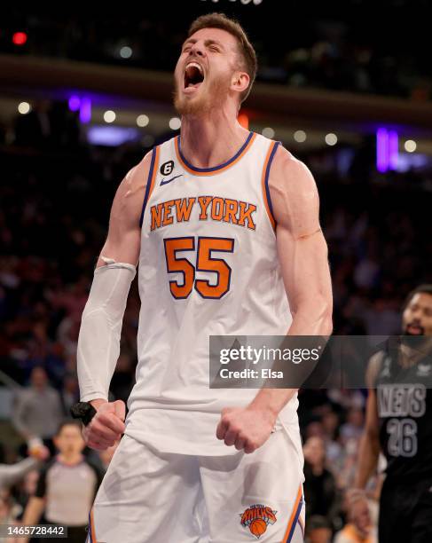 Isaiah Hartenstein of the New York Knicks celebrates after teammate Josh Hart is fouled by the Brooklyn Nets during the second half at Madison Square...