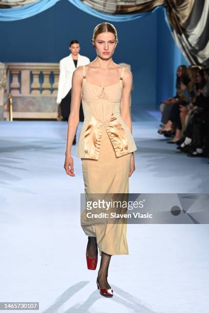 Model walks the runway wearing Tory Burch during Fall/Winter 2023 New York Fashion Week on February 13, 2023 in New York City.