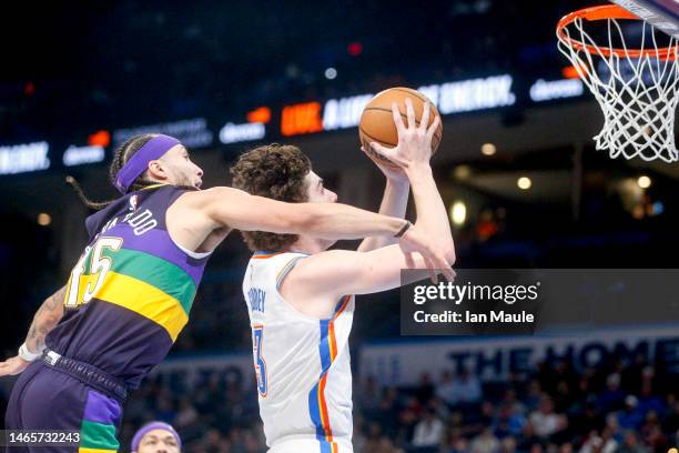 Josh Giddey of the Oklahoma City Thunder drives past Jose Alvarado of the New Orleans Pelicans during the fourth quarter at Paycom Center on February...