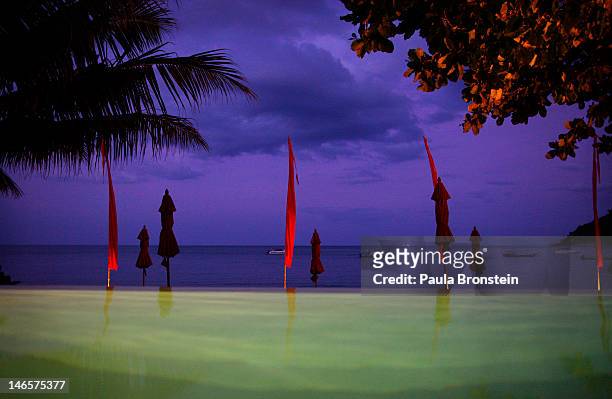The night sky is seen against a swimming pool at the Anantara Rasananda resort June 18, 2012 on the island of Koh Phangan off the coast of Koh Samui...