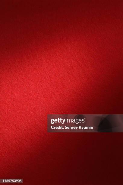 red felt with lighting - red texture stock-fotos und bilder