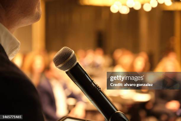 unrecognizable businessman giving speech to professional audience - auditorium stock pictures, royalty-free photos & images