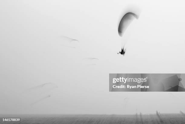 Competitor flies during the Powered Paragliding Open Individual Economy Final on Day 4 of the 3rd Asian Beach Games Haiyang 2012 on June 20, 2012 in...