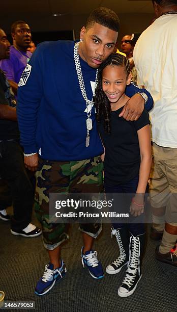 Nelly and DeyJah Harris attend 107.9 Birthday Bash 17 at Philips Arena on June 16, 2012 in Atlanta, Georgia.