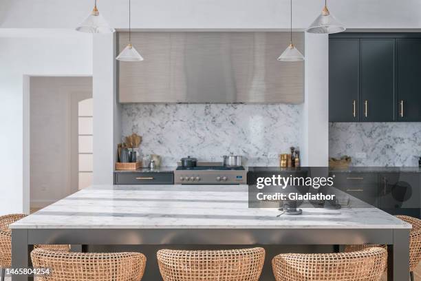 large modern gray kitchen with rectangular white and gray marble breakfast kitchen island with rattan stools - kookeiland stockfoto's en -beelden