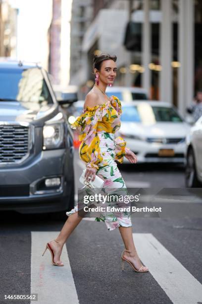 Guest wears pink and stones pendant earrings, a pale pink and white embroidered flower halter-neck / shoulder-off / long sleeves / ruffled silk...