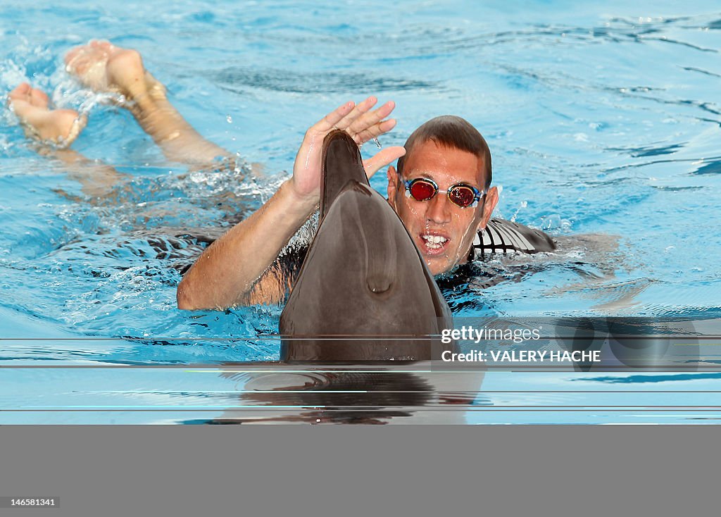 French swimmer Alain Bernard swims with 