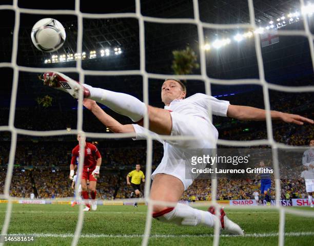 John Terry of England clears an effort from Marko Devic of Ukraine off the line during the UEFA EURO 2012 group D match between England and Ukraine...