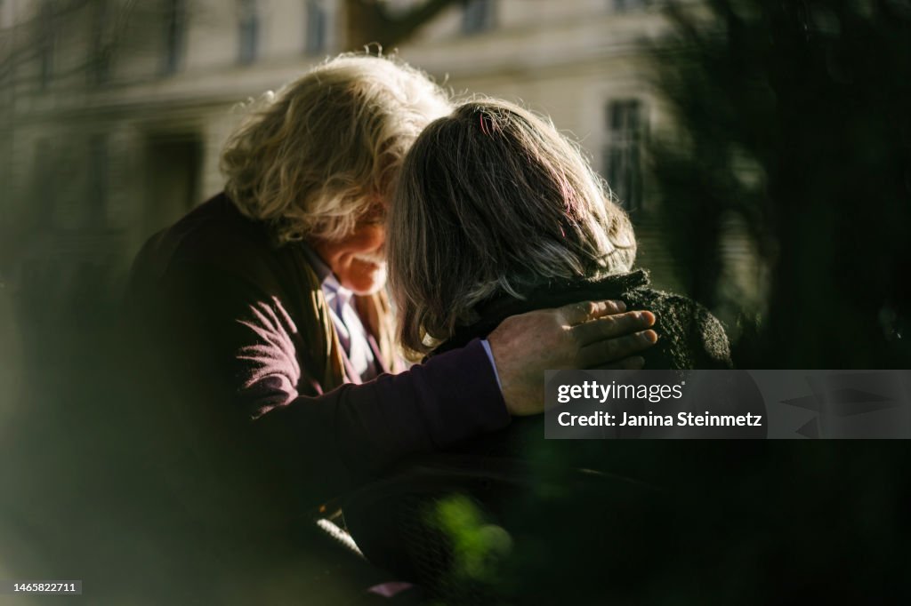 Rear view of senior couple with arm around each other