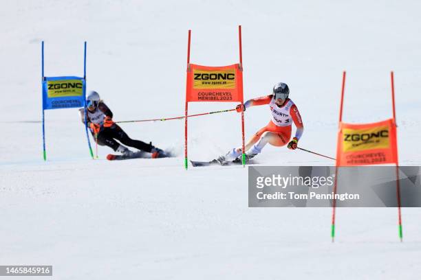 Wendy Holdener of Switzerland and Liene Bondare of Latvia compete in Mixed Team Parallel Slalom at the FIS Alpine World Ski Championships on February...