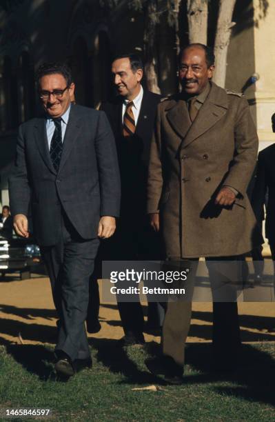 Secretary of State Henry Kissinger with Egyptian President Anwar Al Sadat after a meeting at Sadat's country palace near Cairo, Egypt, on December...
