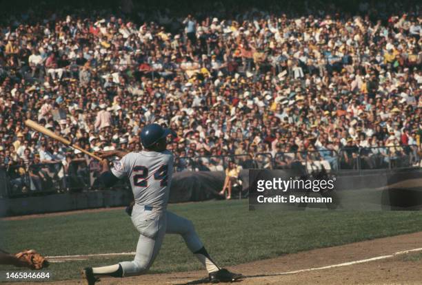 The New York Mets' Willie Mays swinging and missing on a pitch against the Oakland Athletics in the World Series in Oakland, California, in October...