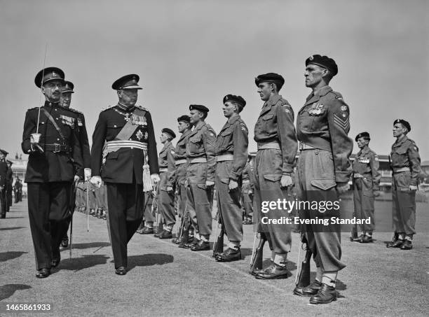 British peer Bernard Fitzalan-Howard, Duke of Norfolk, during a military inspection with Royal Sussex Regiment personnel, as the 4th/5th Battalion of...