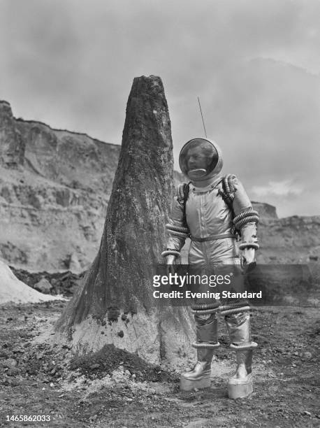 British actor Kenneth More wearing a space suit on the set of 'Man in the Moon', at Pinewood Studios in Iver Heath, Buckinghamshire, England, 16th...