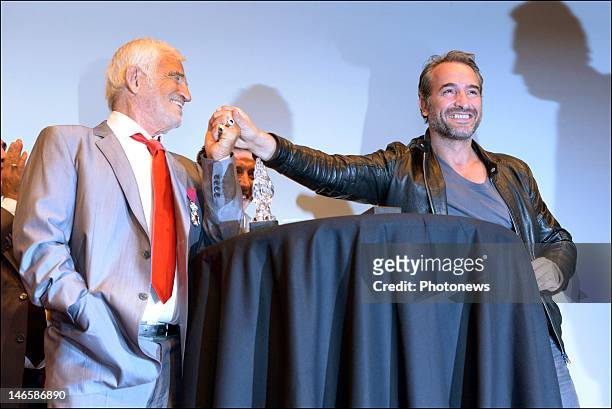Legendary French actor Jean-Paul Belmondo with French actor Jean Dujardin while receiving the Order of King Leopold for his Life Achievement on June...