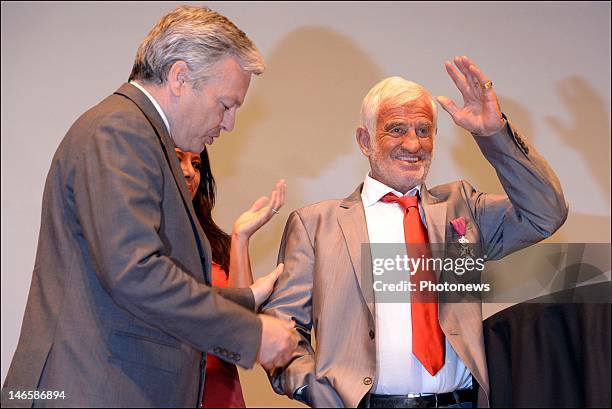 Legendary French actor Jean-Paul Belmondo with Belgian Minister Didier Reynders while receiving the Order of King Leopold for his Life Achievement on...