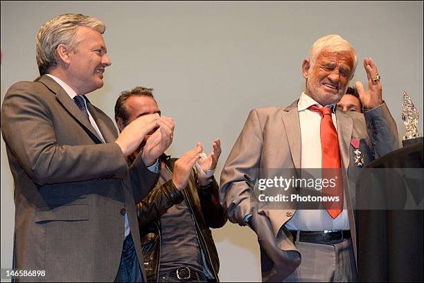 Legendary French actor Jean-Paul Belmondo with Belgian Minister Didier Reynders while receiving the Order of King Leopold for his Life Achievement on...