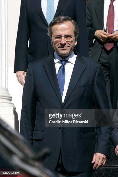 Newly appointed Greek Prime Minister Antonis Samaras stands after being sworn in outside the Premier's office June 20, 2012 in Athens, Greece....