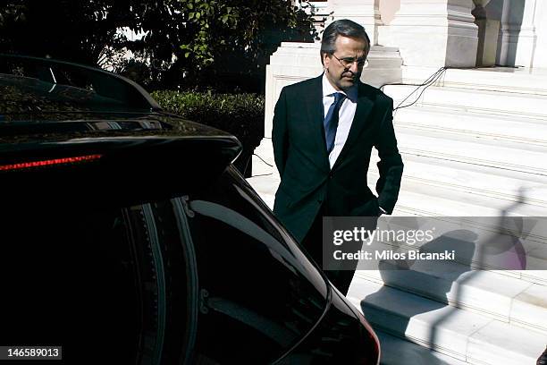 Newly appointed Greek Prime Minister Antonis Samaras stands after being sworn in outside the Premier's office June 20, 2012 in Athens, Greece....