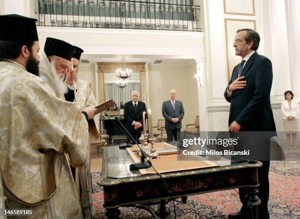 Newly appointed Greek Prime Minister Antonis Samara is sworn in at the presidential palace as President Karolos Papoulias June 20, 2012 in Athens,...