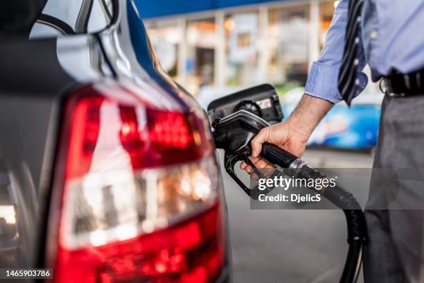 Car Fuiling Businessman Pumping Gas Photos and Premium High Res Pictures - Getty Images