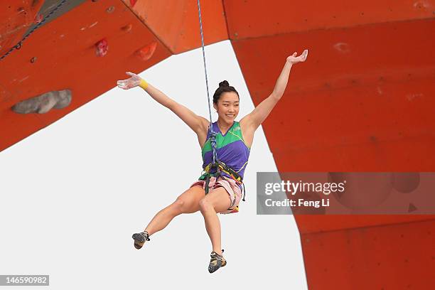 Kim Ja In of South Korea celebrates after winning the Sport Climbing Women's Lead Final on Day 4 of the 3rd Asian Beach Games Haiyang 2012 on June...