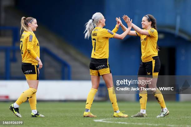 Laura Cooper, Tammi George and Beth Merrick of Wolverhampton Wanderers celebrate victory following the FAWNL Northern Premier Division match between...