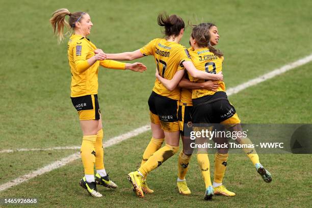 Jade Cross of Wolverhampton Wanderers celebrates with teammates after scoring their team's second goal during the FAWNL Northern Premier Division...