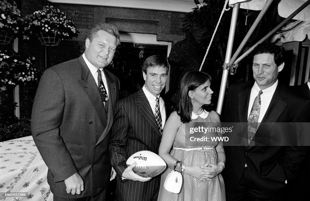 Guest, Tommy Hilfiger, Susie Hilfiger, and Steve Young attend a... News ...