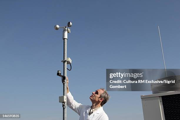 scientist examining air metereology - meteorologist stock pictures, royalty-free photos & images