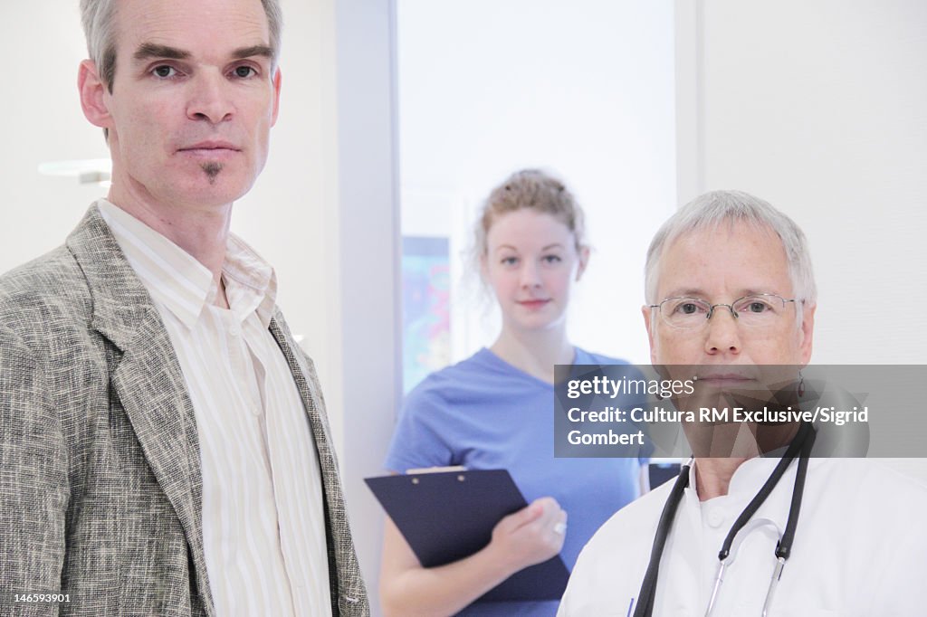 Doctor, nurse and patient in office