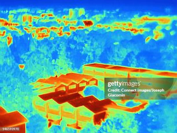 thermal image of rooftops of apartments - thermal imaging stock pictures, royalty-free photos & images