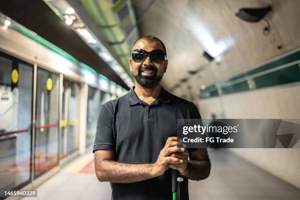 portrait of a blind man at a subway station - accessibility blind stock pictures, royalty-free photos & images