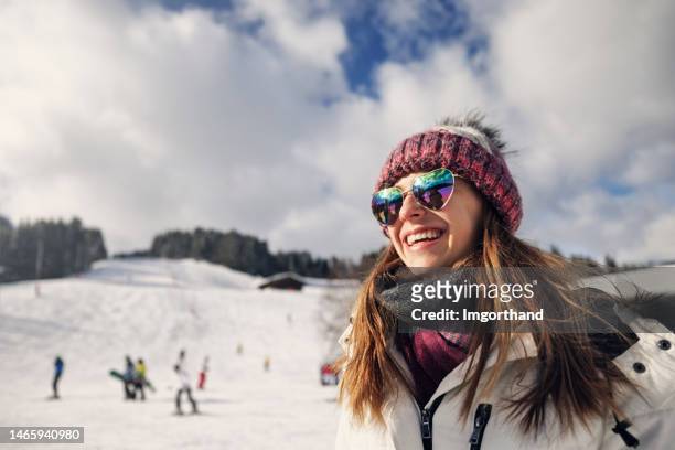 portrait of a teenage girl enjoying skiing in the european alps - austria ski stock pictures, royalty-free photos & images