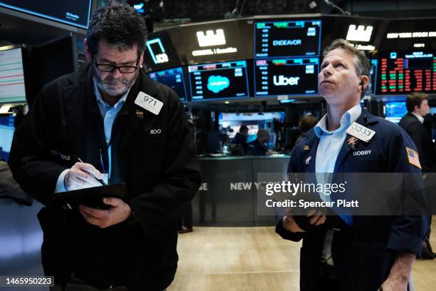 Traders work on the floor of the New York Stock Exchange on February 14, 2023 in New York City. The Dow was down in morning trading following news...